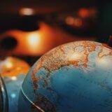 selective focus photo of terrestrial desk globe